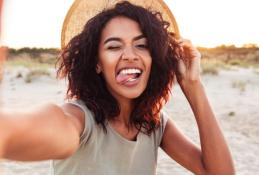 Portrait happy, smiling woman sitting in the car looking out windows.jpg