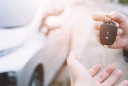 Portrait happy, smiling woman sitting in the car looking out windows.jpg