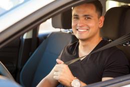 Portrait happy, smiling woman sitting in the car looking out windows.jpg