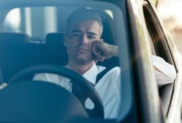 Portrait happy, smiling woman sitting in the car looking out windows.jpg