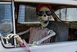 Portrait happy, smiling woman sitting in the car looking out windows.jpg