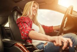 Portrait happy, smiling woman sitting in the car looking out windows.jpg