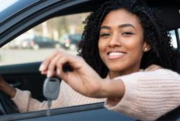 Portrait happy, smiling woman sitting in the car looking out windows.jpg