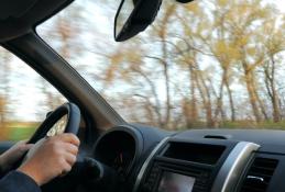 Portrait happy, smiling woman sitting in the car looking out windows.jpg