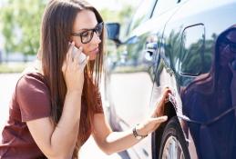 Portrait happy, smiling woman sitting in the car looking out windows.jpg