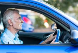 Portrait happy, smiling woman sitting in the car looking out windows.jpg