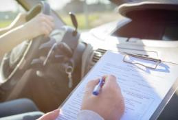 Portrait happy, smiling woman sitting in the car looking out windows.jpg