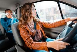 Portrait happy, smiling woman sitting in the car looking out windows.jpg