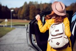 Portrait happy, smiling woman sitting in the car looking out windows.jpg