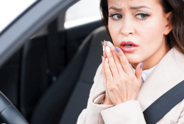 Portrait happy, smiling woman sitting in the car looking out windows.jpg