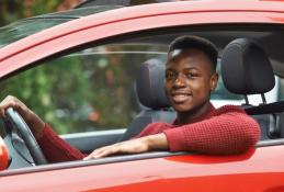 Portrait happy, smiling woman sitting in the car looking out windows.jpg