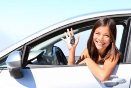 Portrait happy, smiling woman sitting in the car looking out windows.jpg