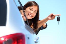 Portrait happy, smiling woman sitting in the car looking out windows.jpg