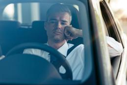 Portrait happy, smiling woman sitting in the car looking out windows.jpg