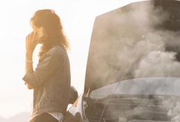 Portrait happy, smiling woman sitting in the car looking out windows.jpg