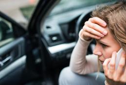 Portrait happy, smiling woman sitting in the car looking out windows.jpg