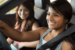 Portrait happy, smiling woman sitting in the car looking out windows.jpg